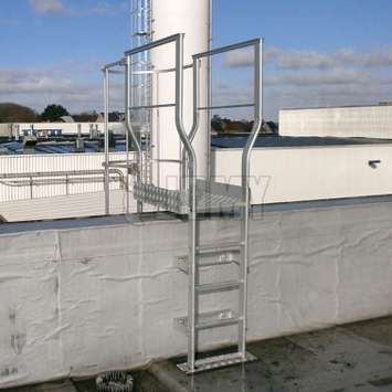 Cage ladder - Landing for parapet crossing Custom made cage ladder roof landing for parapet crossing.